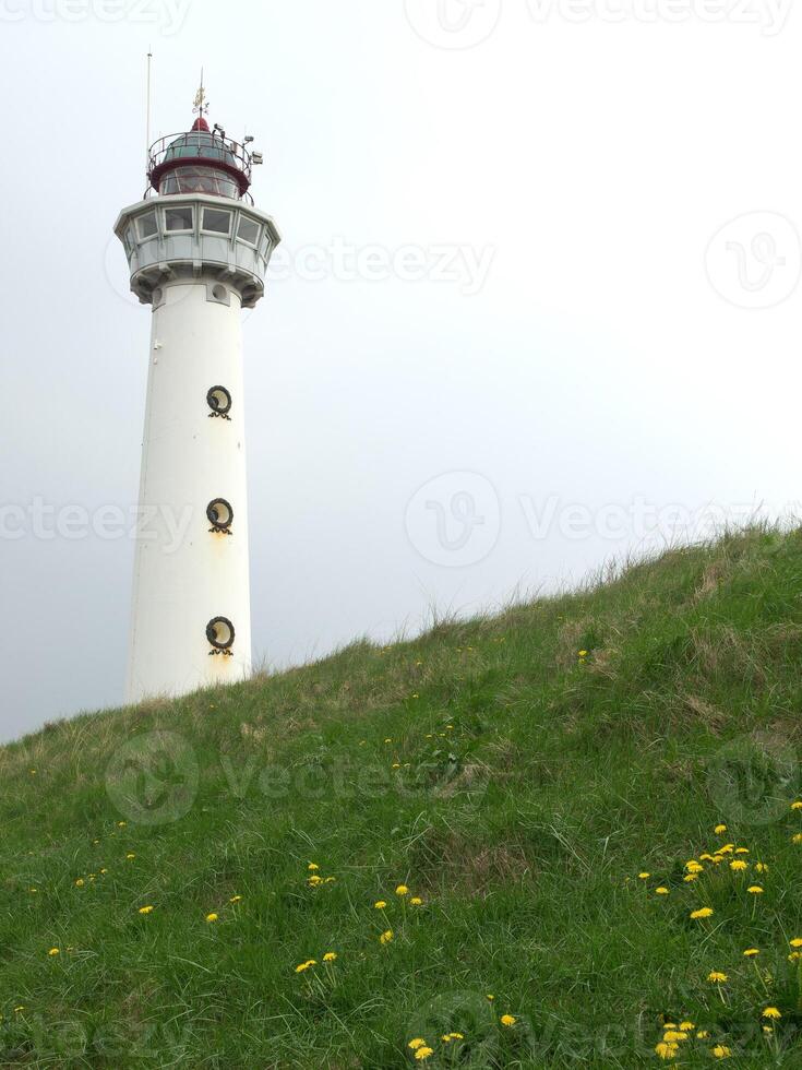 A white and red lighthouse photo