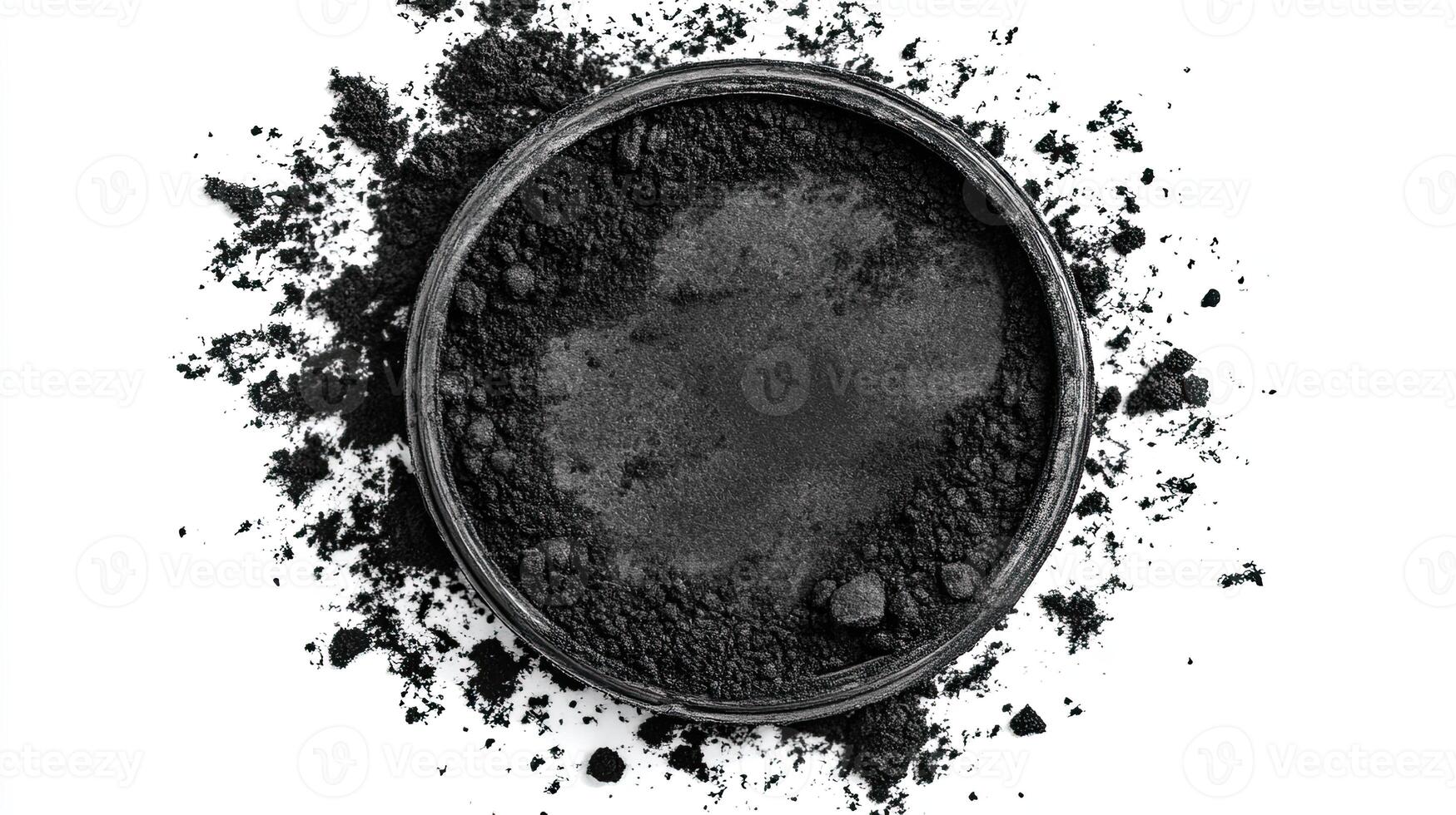Black powder in a round container. Concept of Cosmetics, Charcoal, Pigment photo