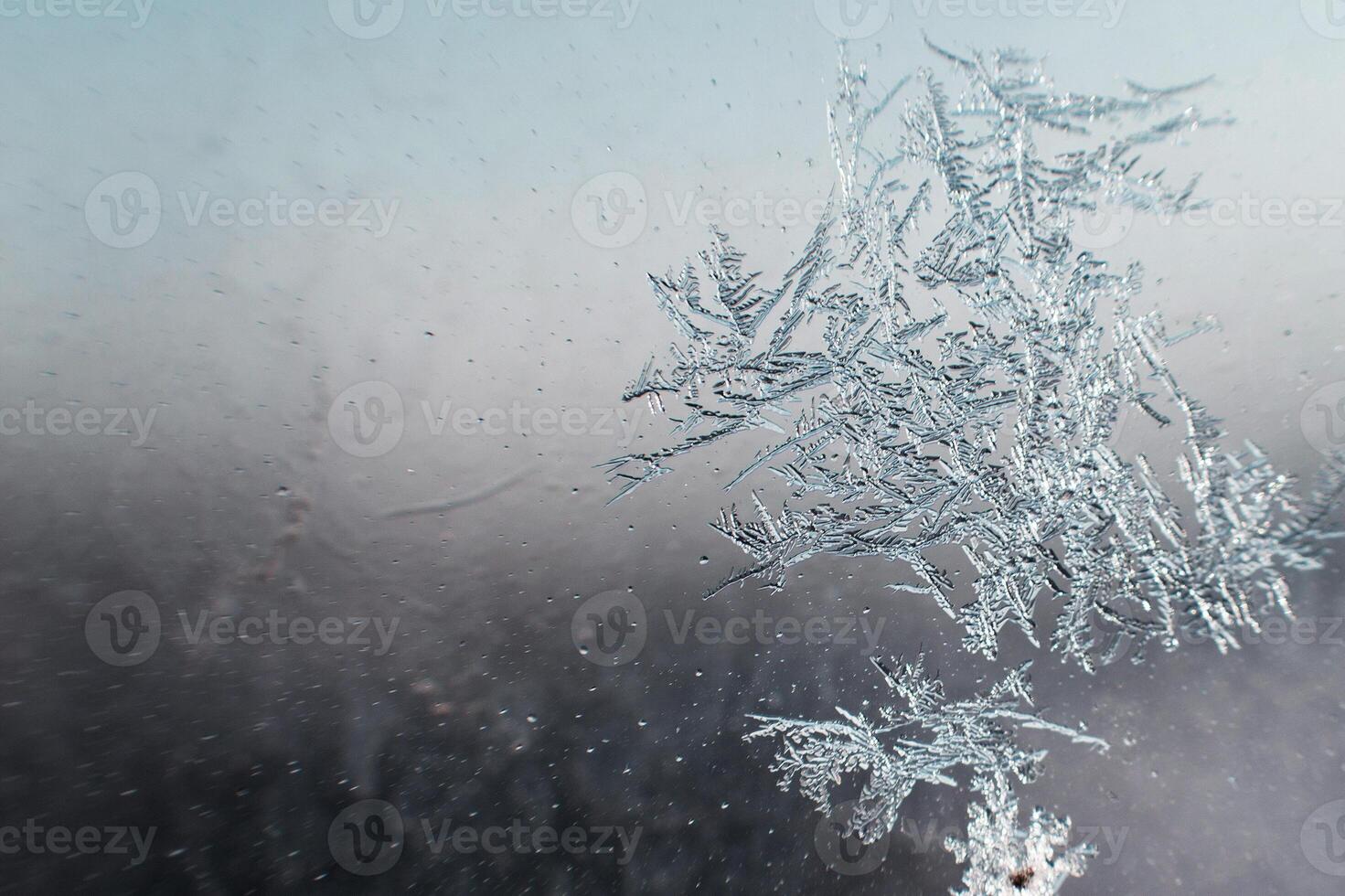 snow pattern on the glass from frost photo