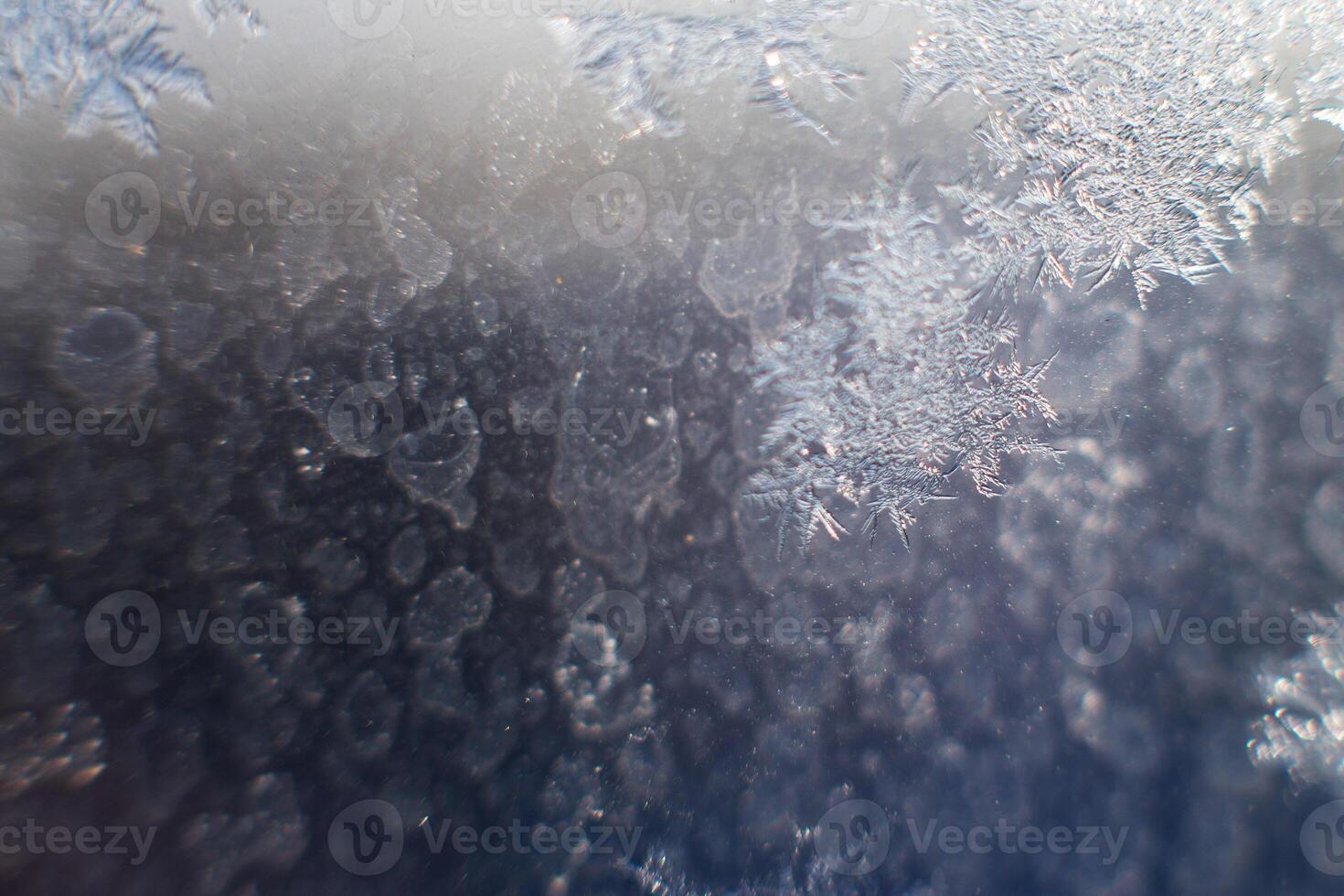 snow pattern on the glass from frost photo