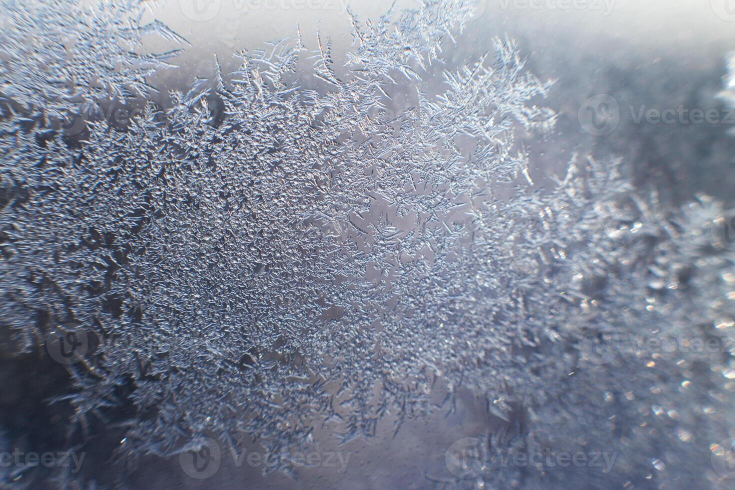 snow pattern on the glass from frost photo