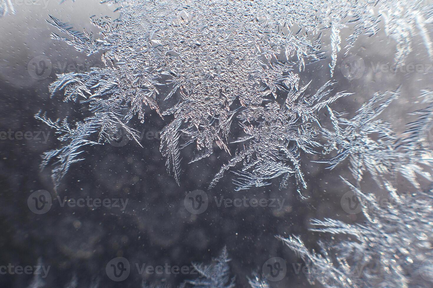 snow pattern on the glass from frost photo