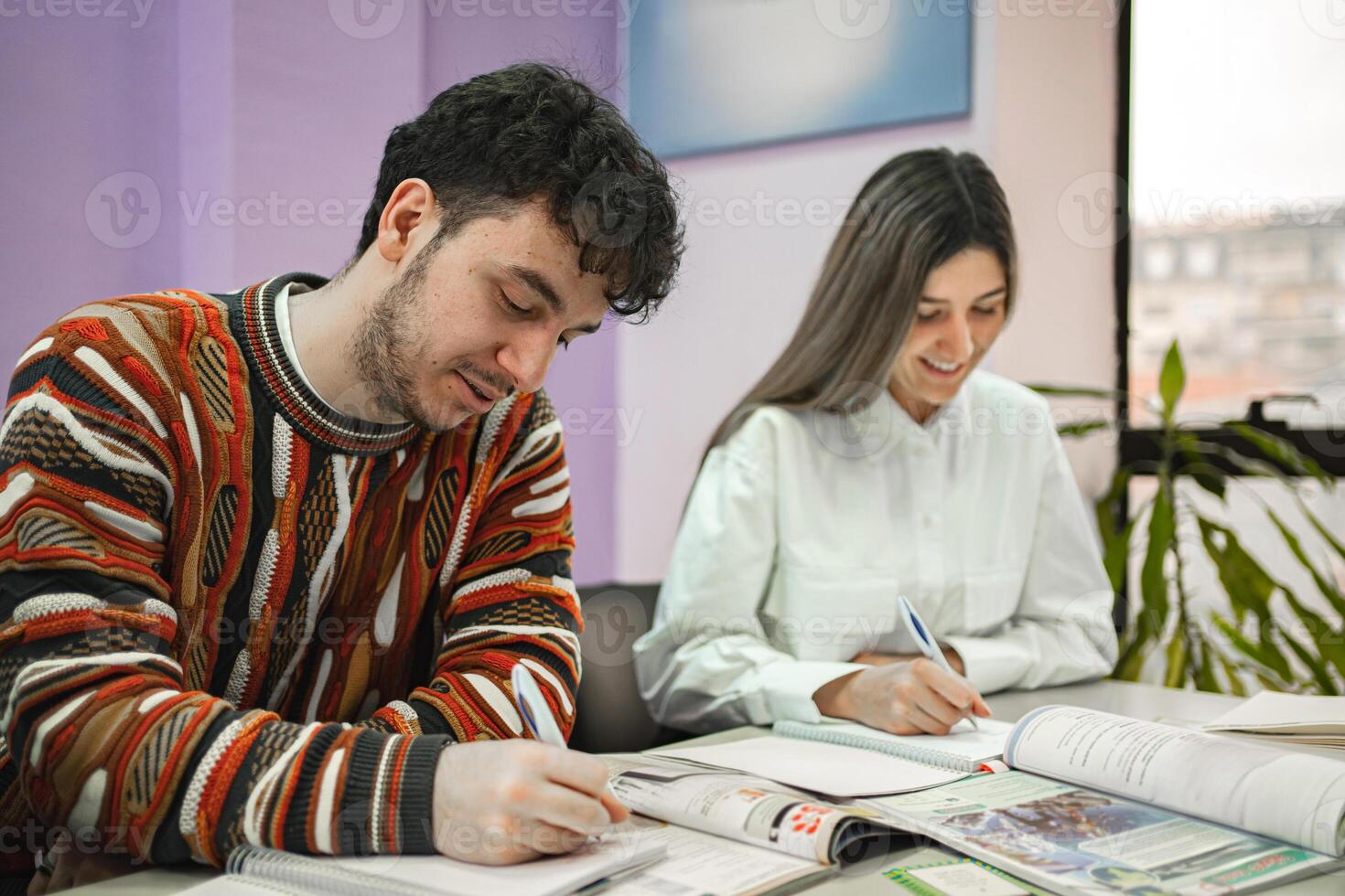 Two students learning together at language school photo