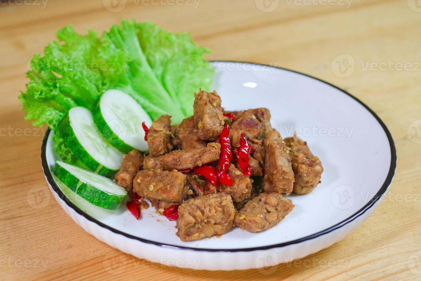 Orek tempe or Sauteed Tempeh is a typical Indonesian cuisine with herbs, garlic, onion, chilli and soy sauce. It tastes delicious photo