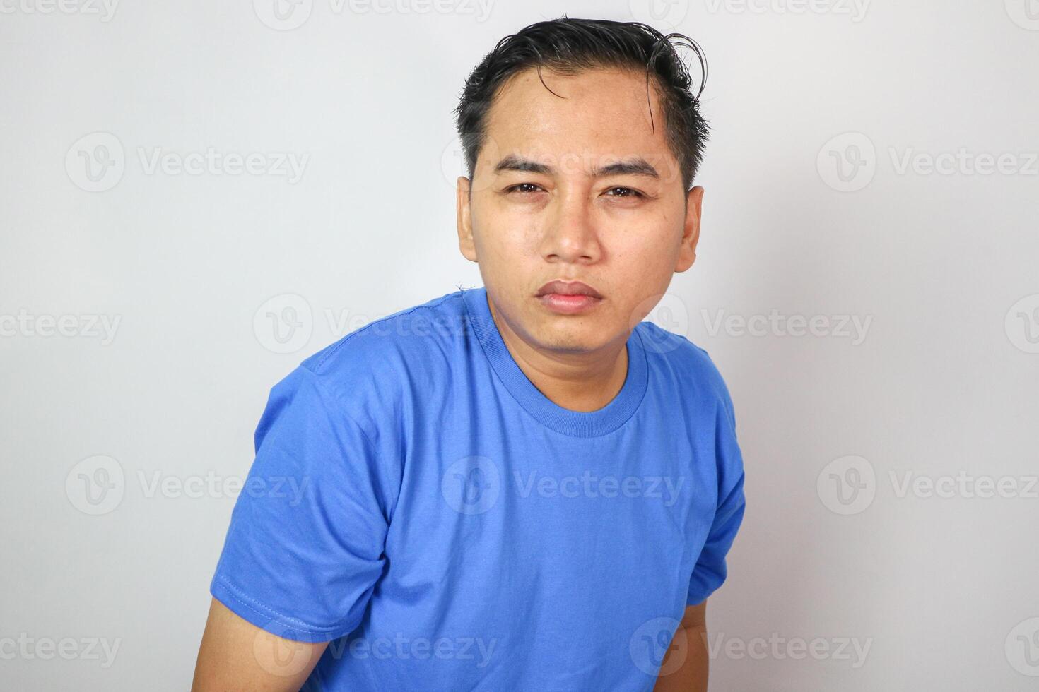 Squinting eyes of a man looking at screen. Poor eyesight, bad vision. Light from laptop computer or phone. photo