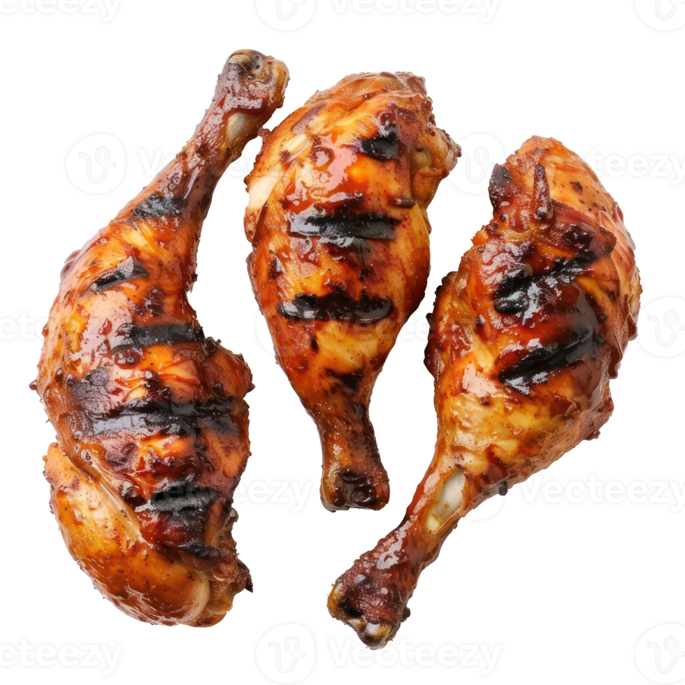 three chicken legs on a grill with a sauce png