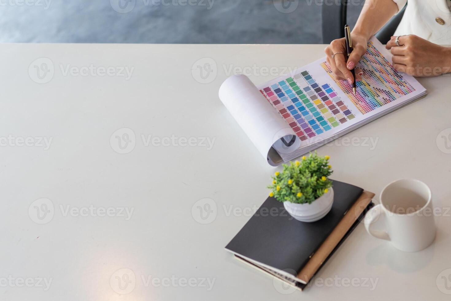 Young designers are choosing color schemes to use in their ux ui website design and working with mobile responsive web developers with ux ui Front End Designer Previewing to make them efficient. photo