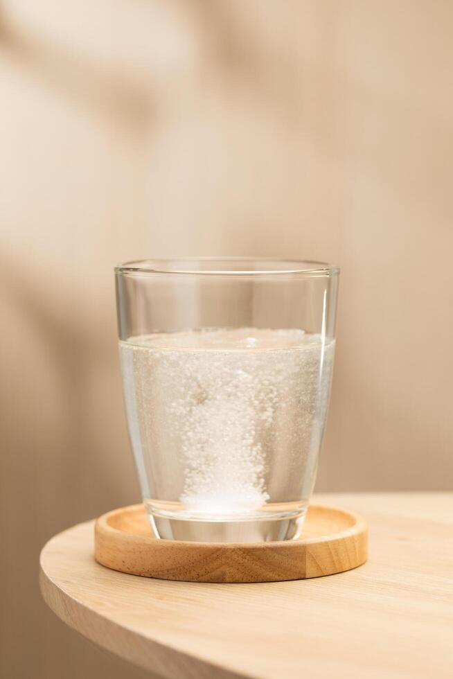 Effervescent mucolytic tablet dissolves in water. photo