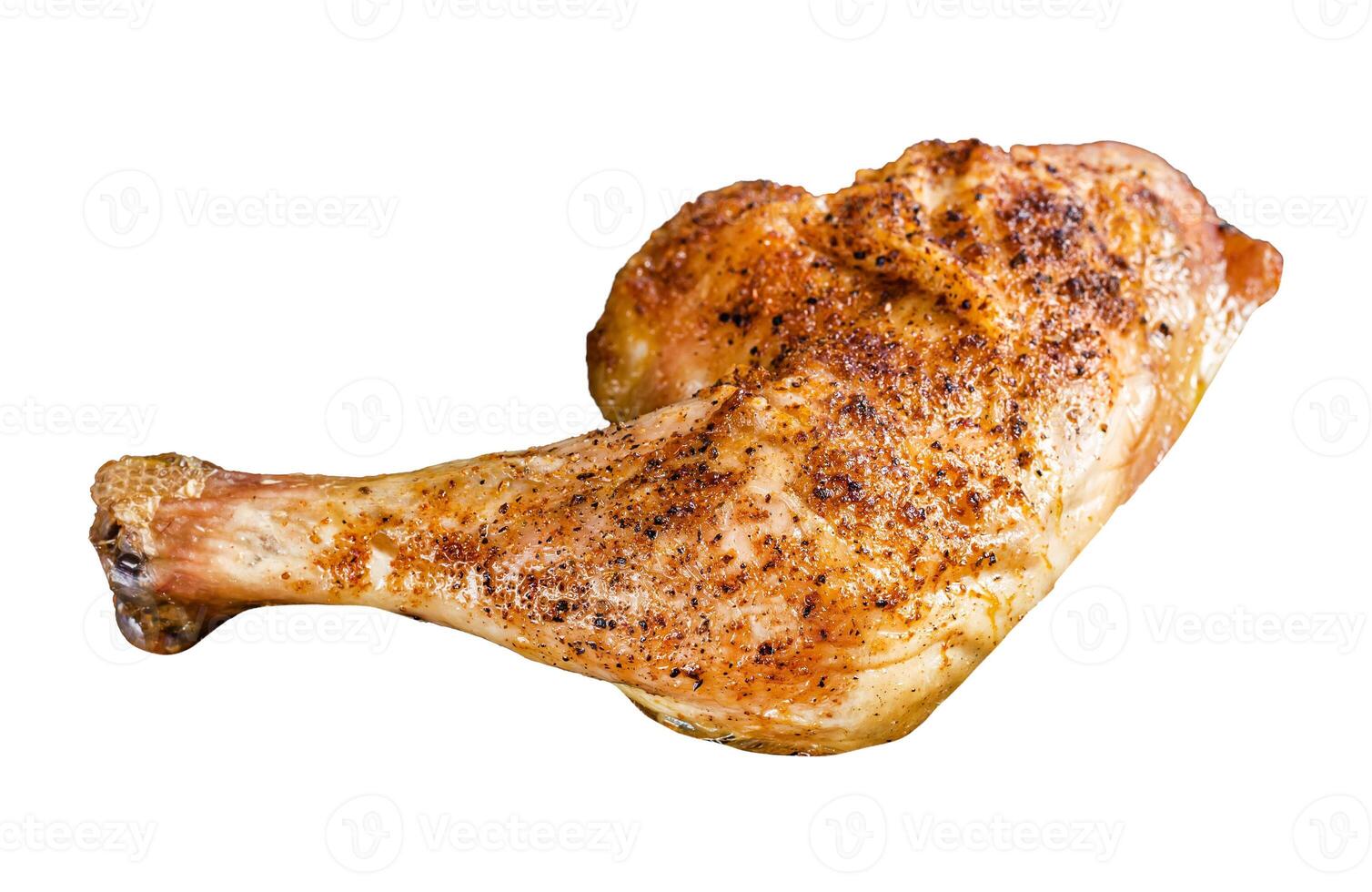 Grilled chicken leg on a wooden board. Isolated on white background. photo