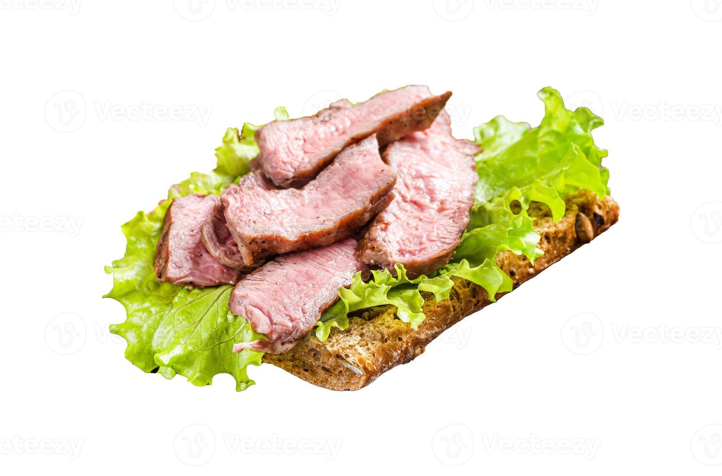 Steak sandwich with sliced roast beef, salad and vegetables. Isolated on white background, top view. photo