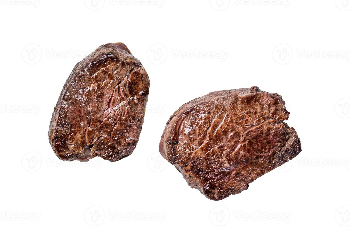 Grilled fillet mignon or tenderloin beef steak Isolated on white background, top view. photo