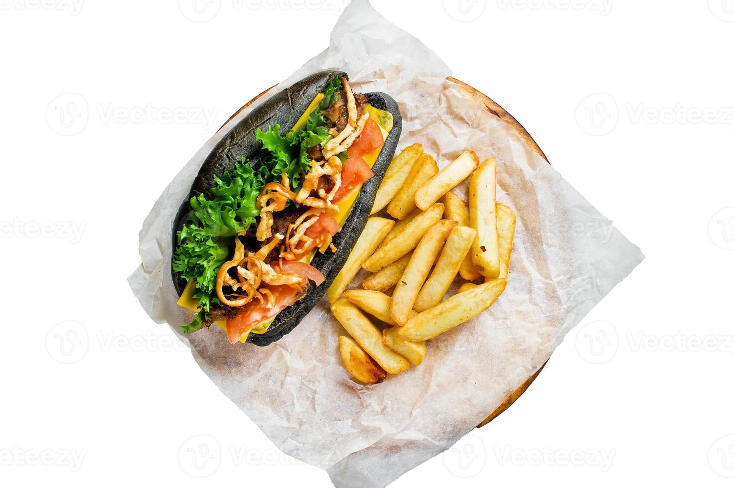 Hot dog with beef sausage and caramelized onions in a black bun. Isolated on white background. photo