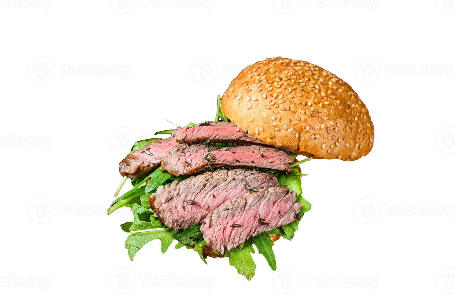 Burger with beef steak slices, arugula and spinach. Isolated on white background, Top view. photo