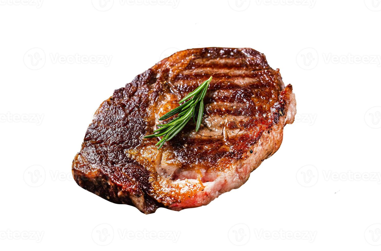 Roasted rib eye steak, ribeye beef meat in a grill pan. Isolated on white background. photo