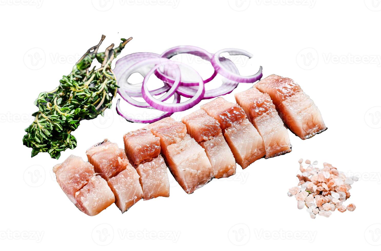 Sliced Fillet of Pickled herring with onion and thyme. Isolated on white background. Top view. photo