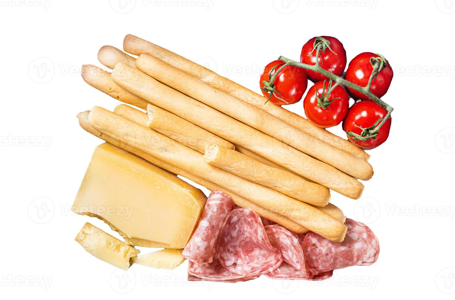 Appetizer platter with grissini bread sticks, salami, tomato and parmesan cheese. Isolated, white background. photo