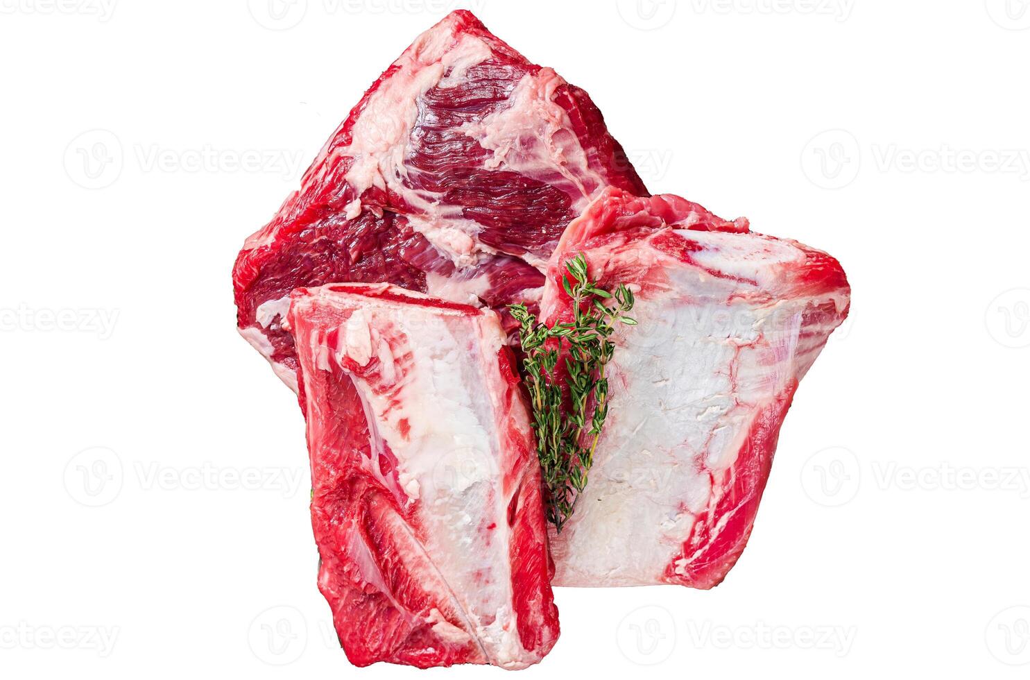 Uncooked Raw veal Short Ribs on rustic plate with rosemary. Isolated on white background. photo