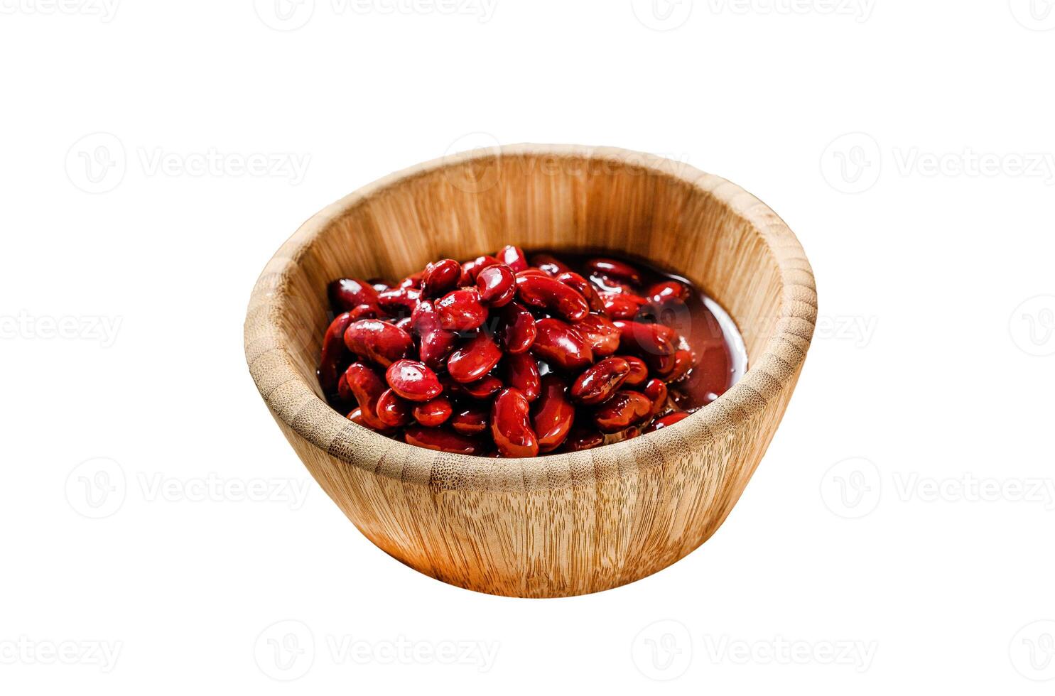 Red canned beans in a bamboo bowl. Isolated on white background. Top view. photo