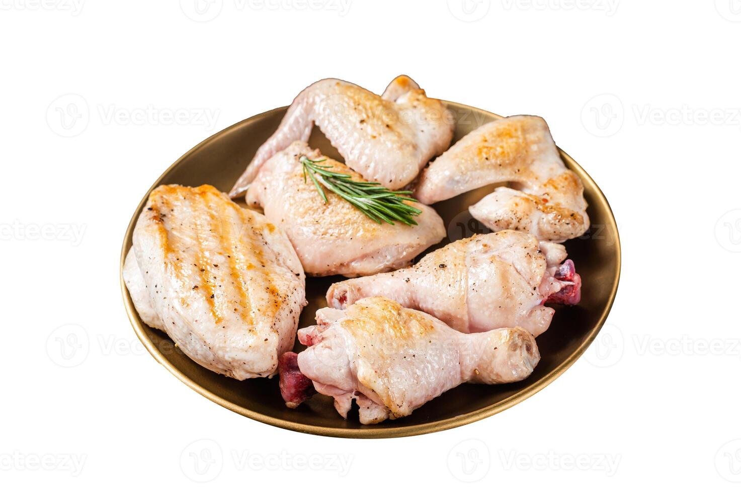Assortment of Roast chicken meat parts on a plate. Drumstick, breast fillet, wing, thigh. Isolated on white background. photo