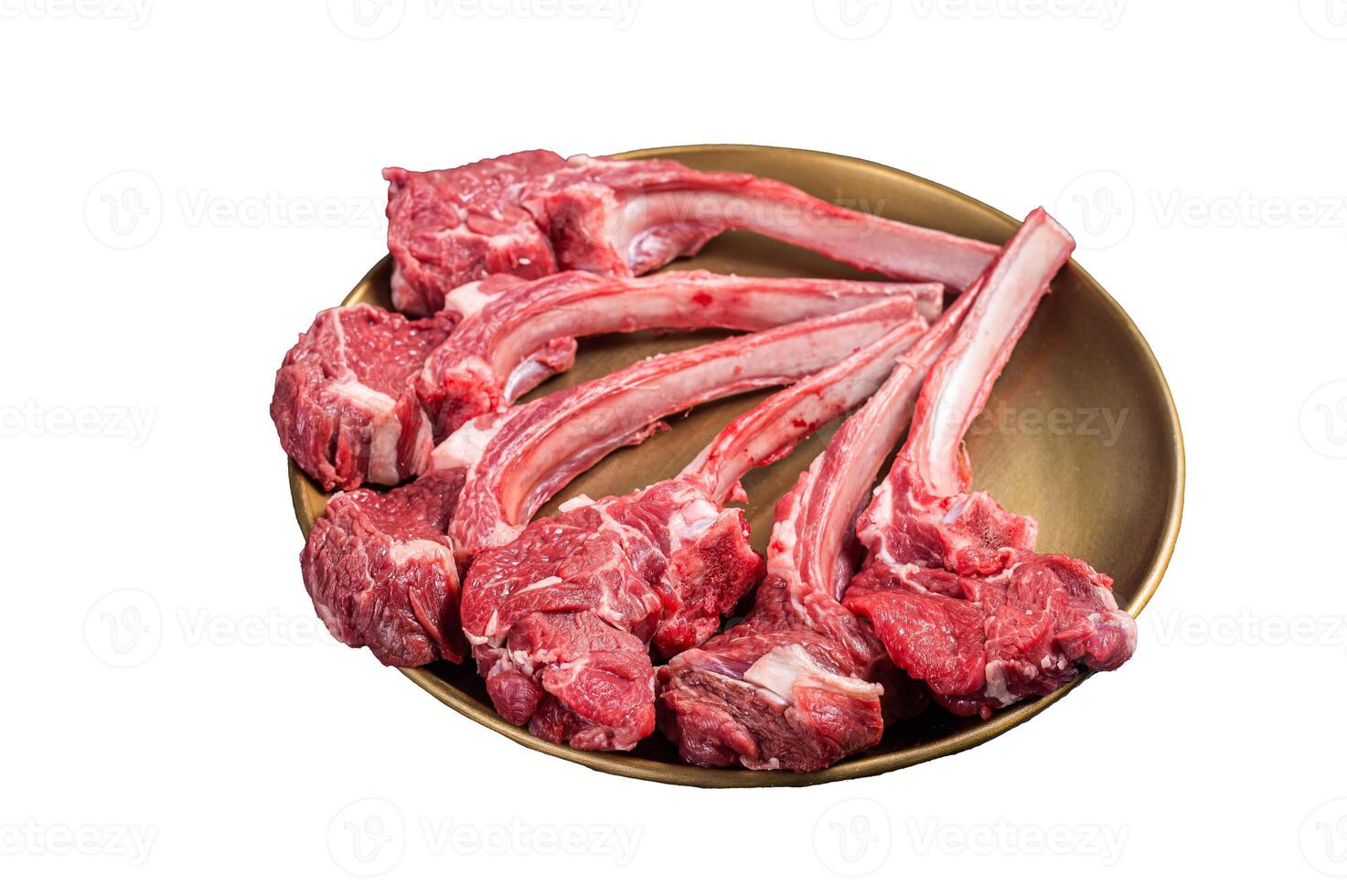Lamb chop rib steak, raw mutton meat cutlet in golden plate. Isolated on white background photo