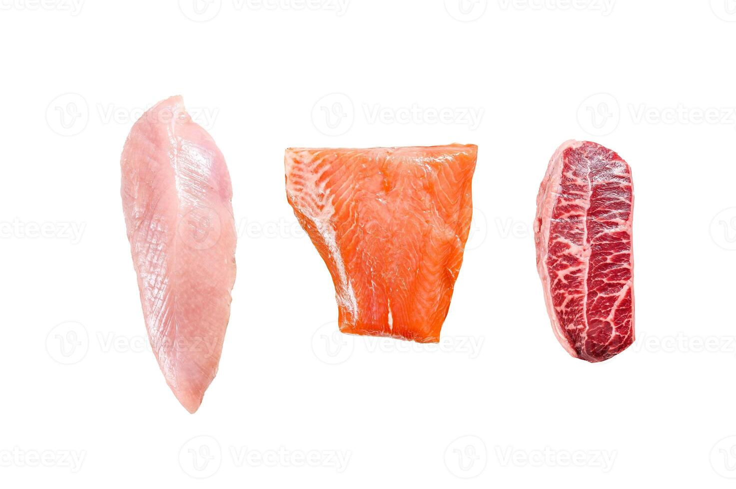 Three types of steaks on wooden table. Beef top blade, salmon fillet and Turkey breast. Organic fish, poultry and beef meat. Isolated on white background. photo