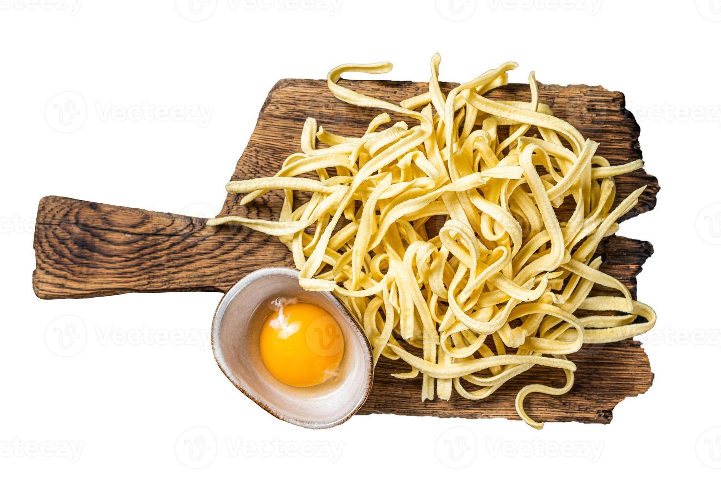 Cooking raw spaetzle egg noodle. Isolated, white background. photo