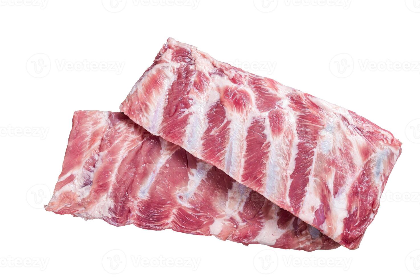 Rack of raw pork spare ribs on butcher table. Isolated on white background. photo