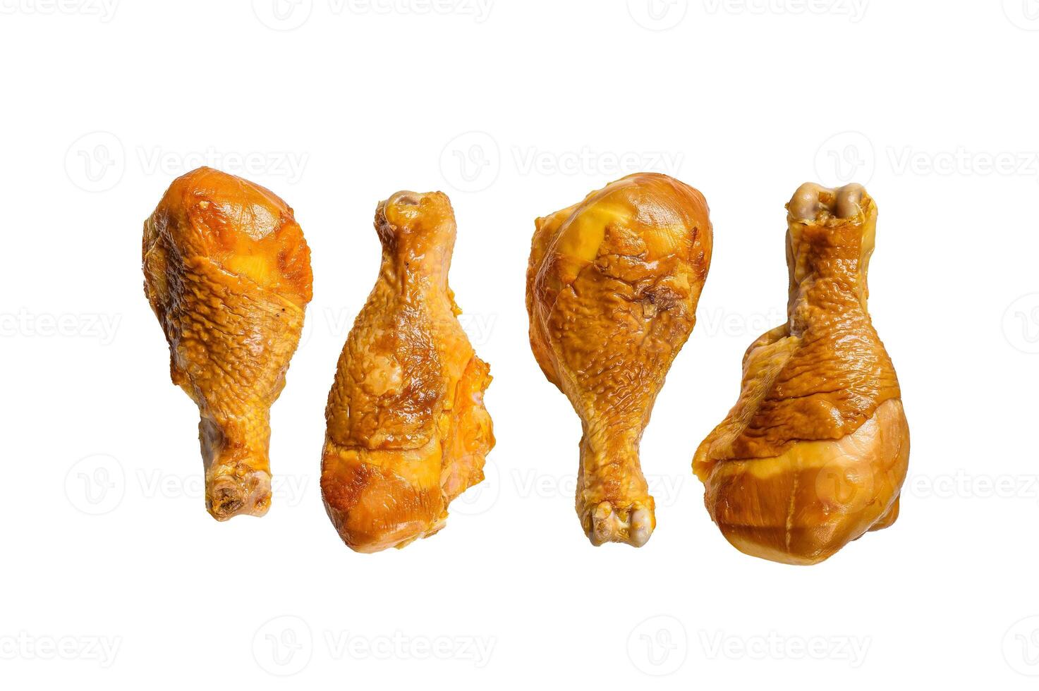 Smoked chicken leg drumsticks on a kitchen table. Isolated on white background. photo