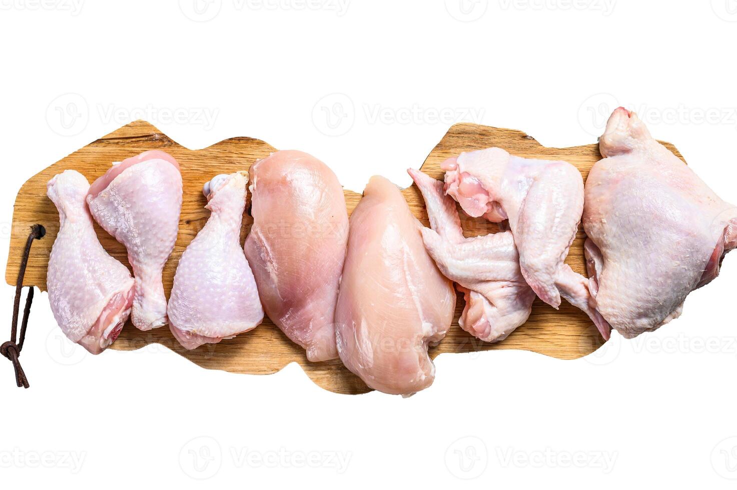 Raw uncooked chicken meat on a cutting board. Isolated on white background. photo
