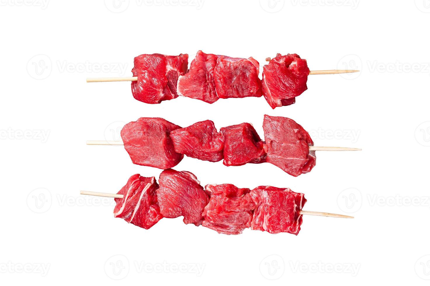 Shashlik raw beef veal shish kebab, Meat with herbs on Skewers. Isolated, white background. photo