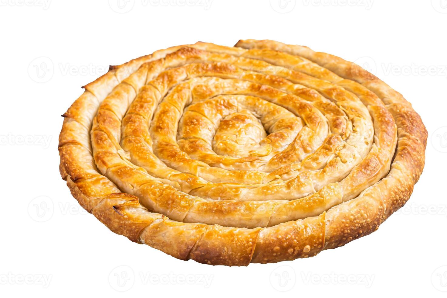 Baked homemade traditional Greek cheese pie on kitchen table. Isolated on white background photo