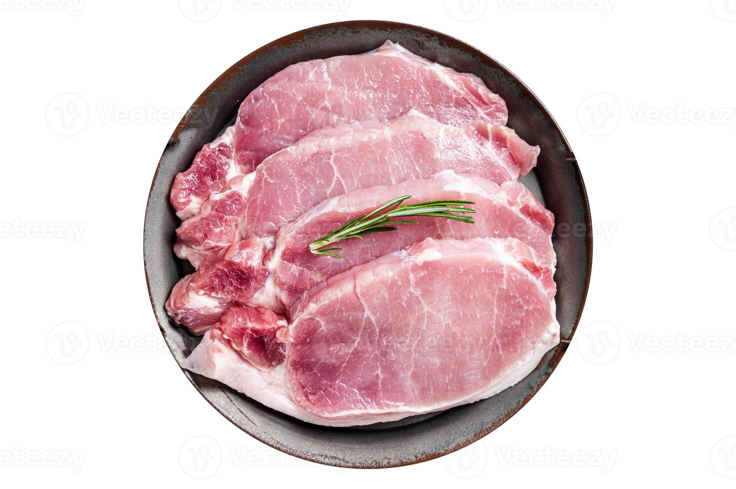 Raw pork chop steaks in steel tray with rosemary. Isolated on white background. photo