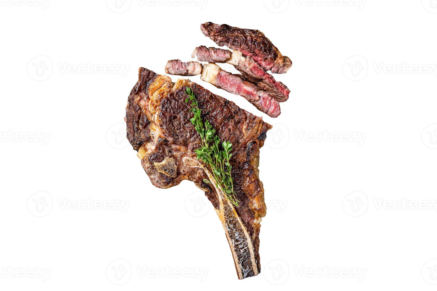 Dry aged grilled Tomahawk or cowboy beef meat steak on a meat cleaver. Isolated, white background. photo