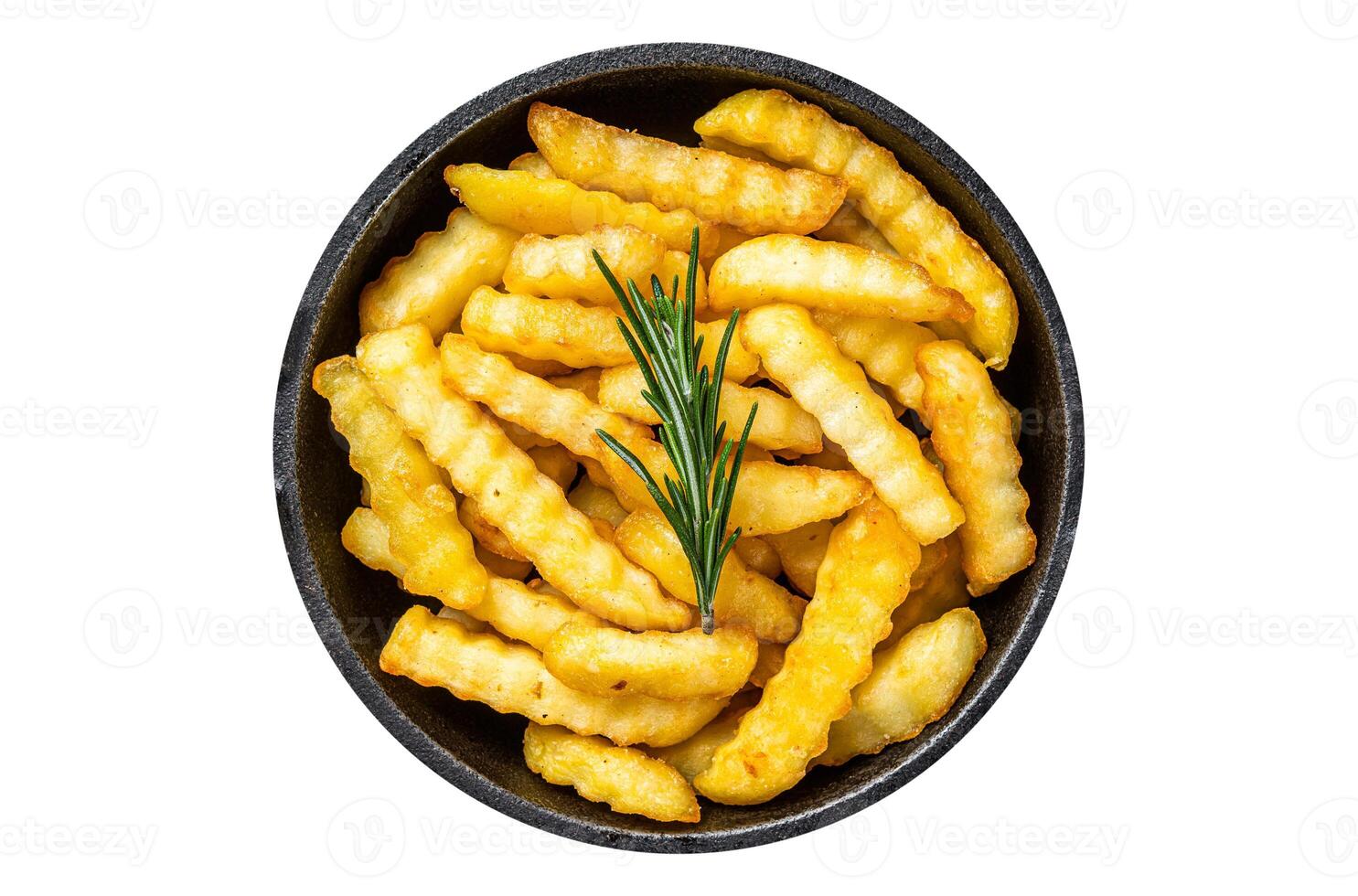 Fried Crinkle French fries potatoes in a pan. Isolated, white background. Top view. photo