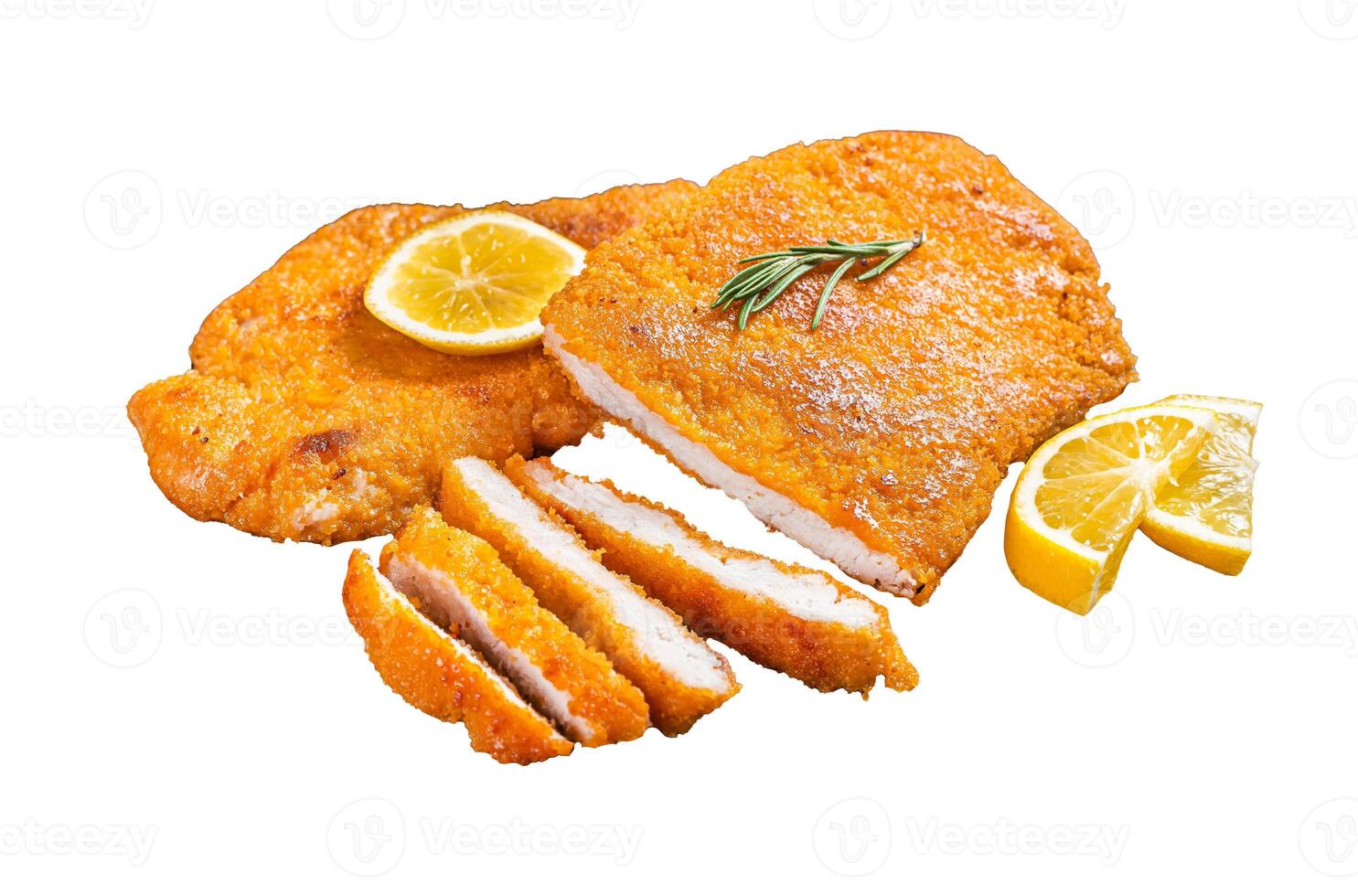 Fried sliced weiner schnitzel on a wooden board with herbs. Isolated, white background. photo