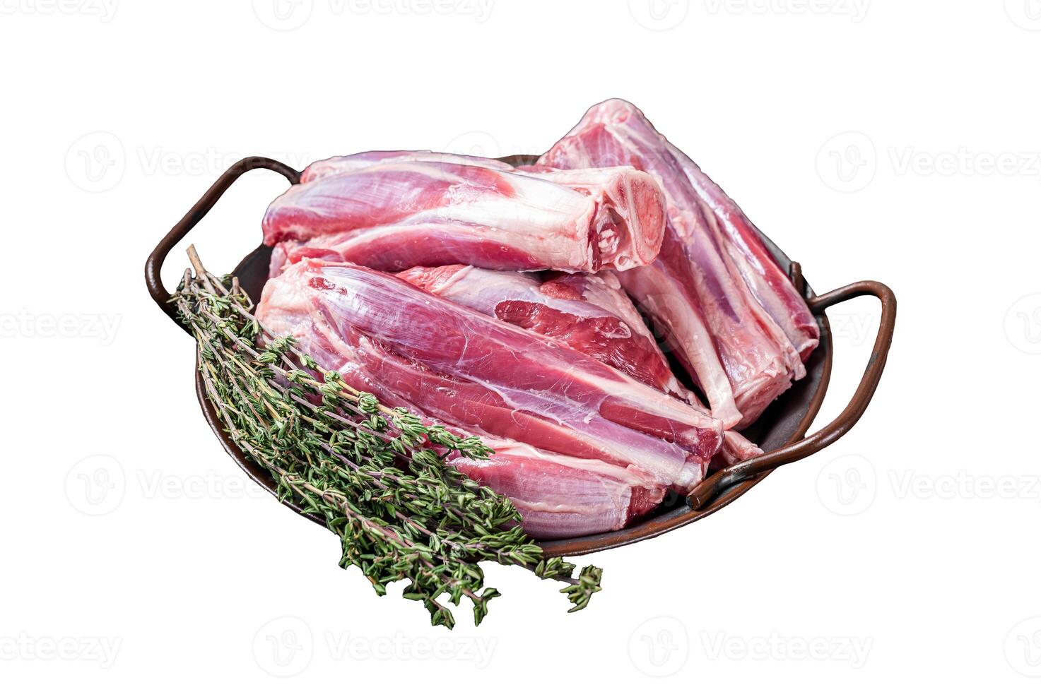 Raw lamb leg shanks in a steel tray with herbs. Isolated on white background. Top view. photo