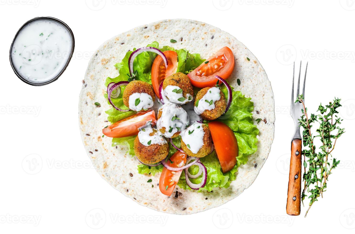Vegetarian falafel with vegetables and tzatziki sauce on a tortilla bread. Isolated on white background, top view. photo