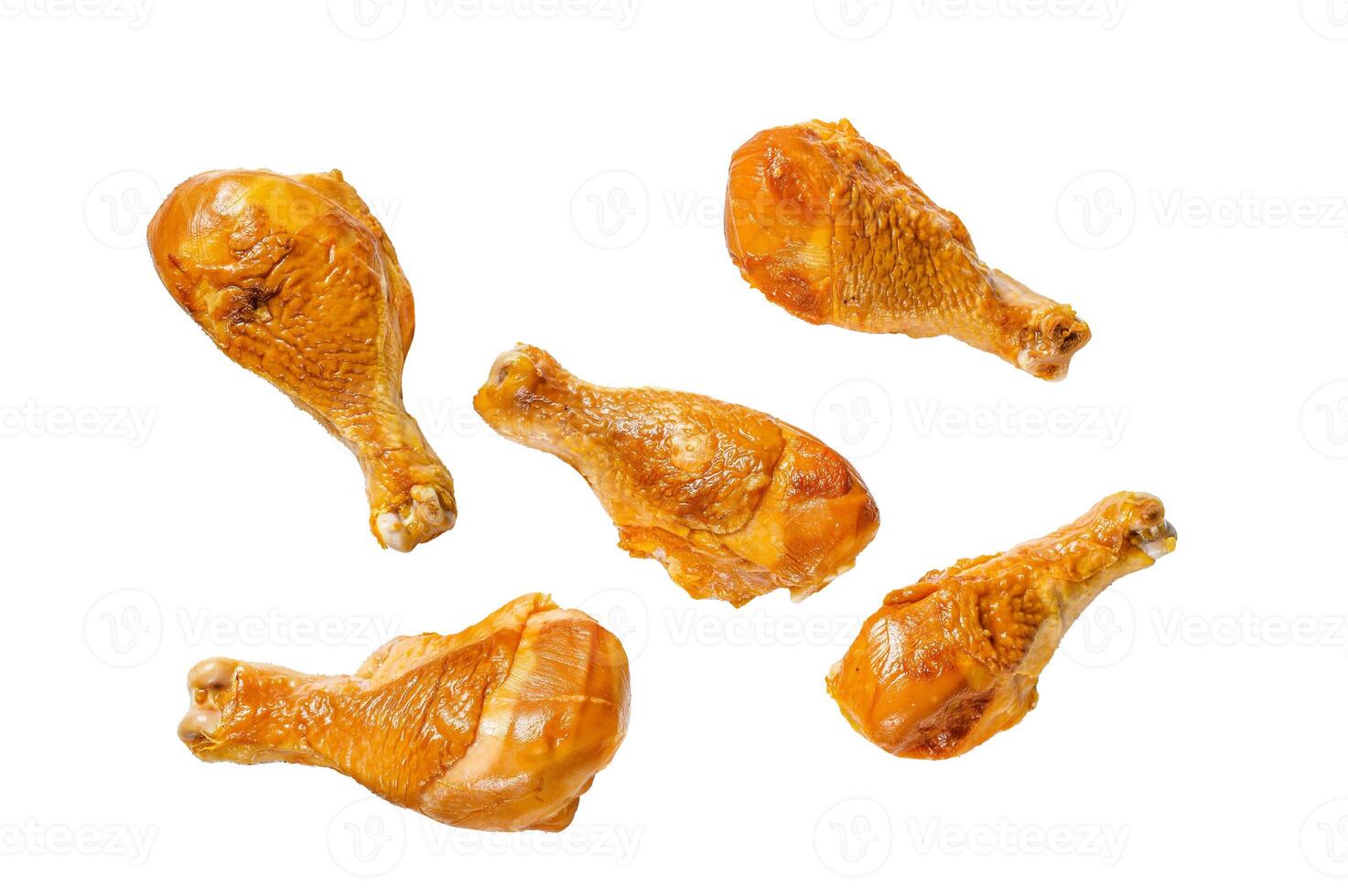 Smoked chicken leg drumsticks on a kitchen table. Isolated on white background, top view. photo