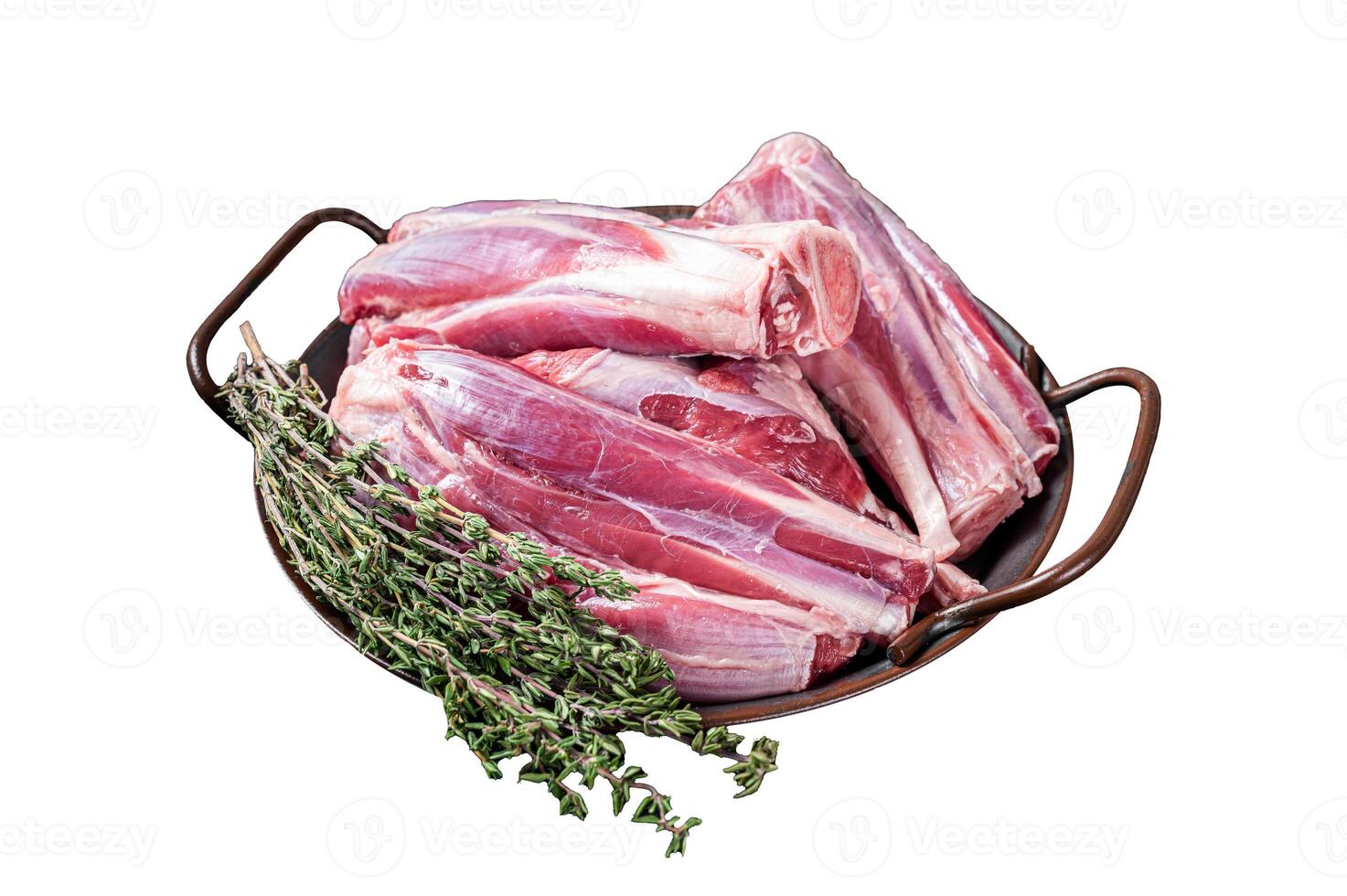 Raw lamb leg shanks in a steel tray with herbs. Isolated on white background. Top view. photo