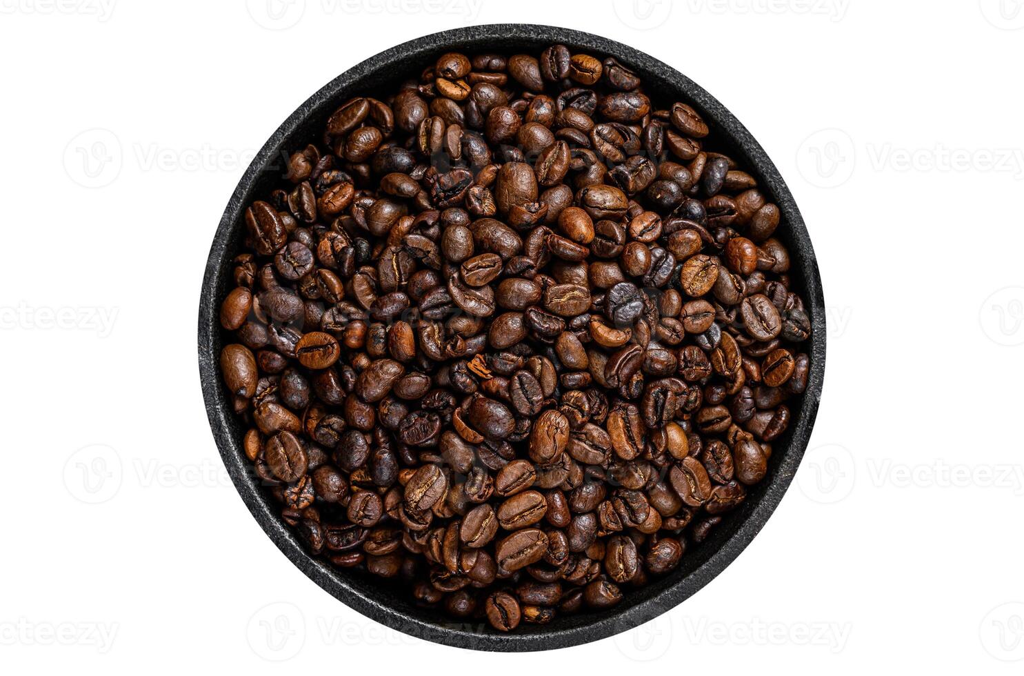 Dark roasted Coffee beans in a pan. Isolated, white background. Top view. photo