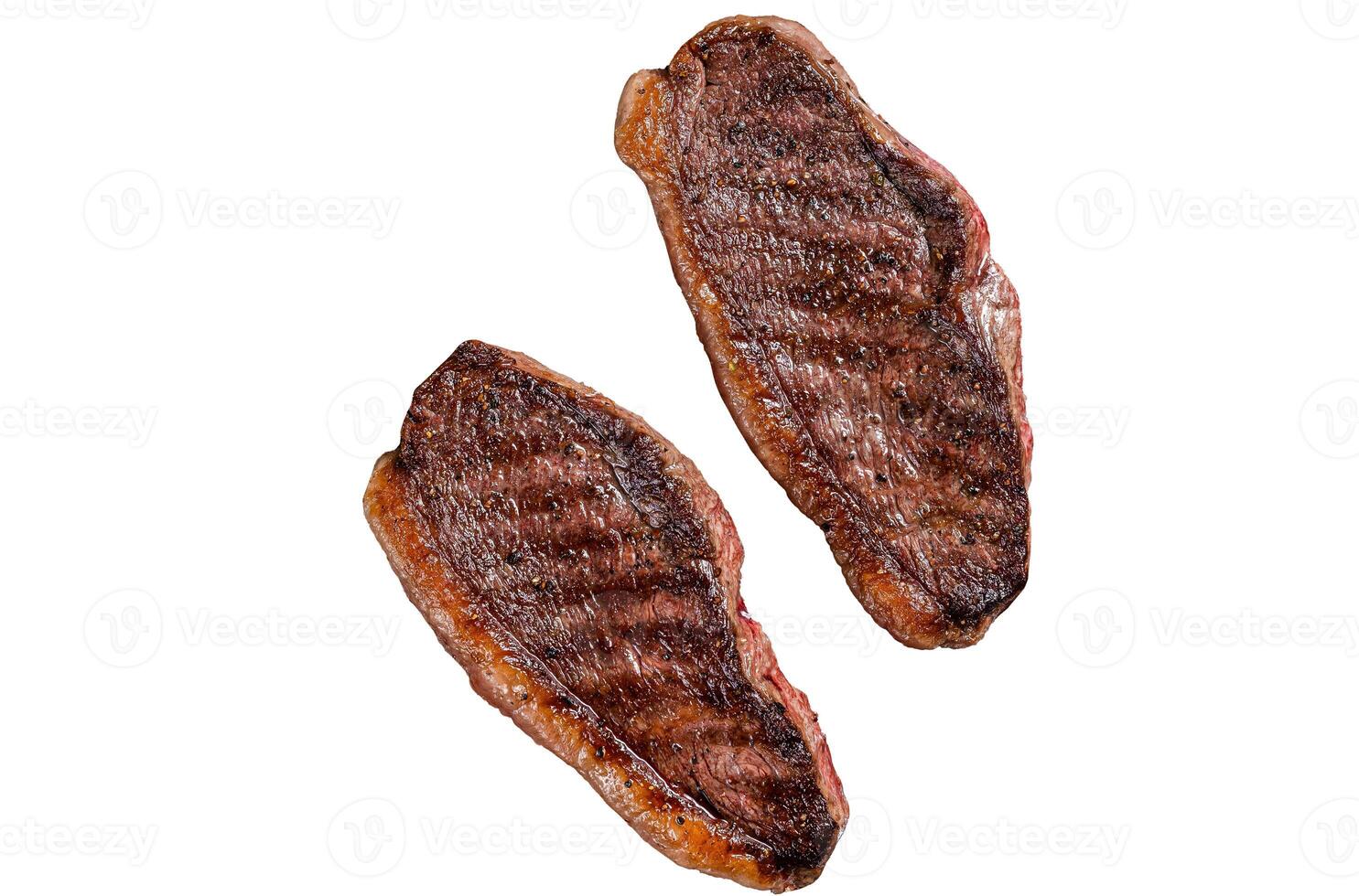 BBQ Grilled cap rump or Top sirloin beef steak, fried meat on grill. Isolated on white background photo
