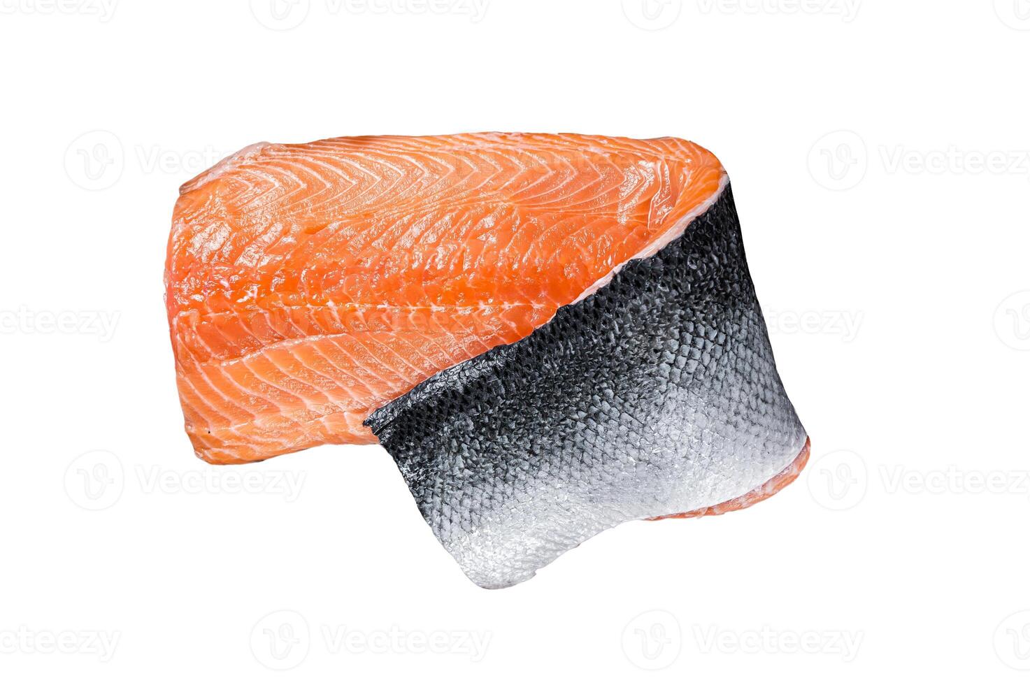 Salmon fillet fish on a wooden board with herbs and salt. Isolated on white background. photo