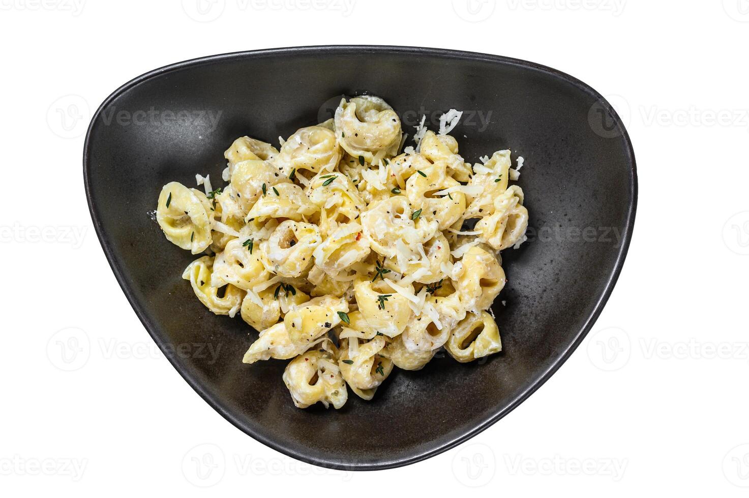Italian tortellini pasta in cream sauce.with spinach. Isolated on white background. photo