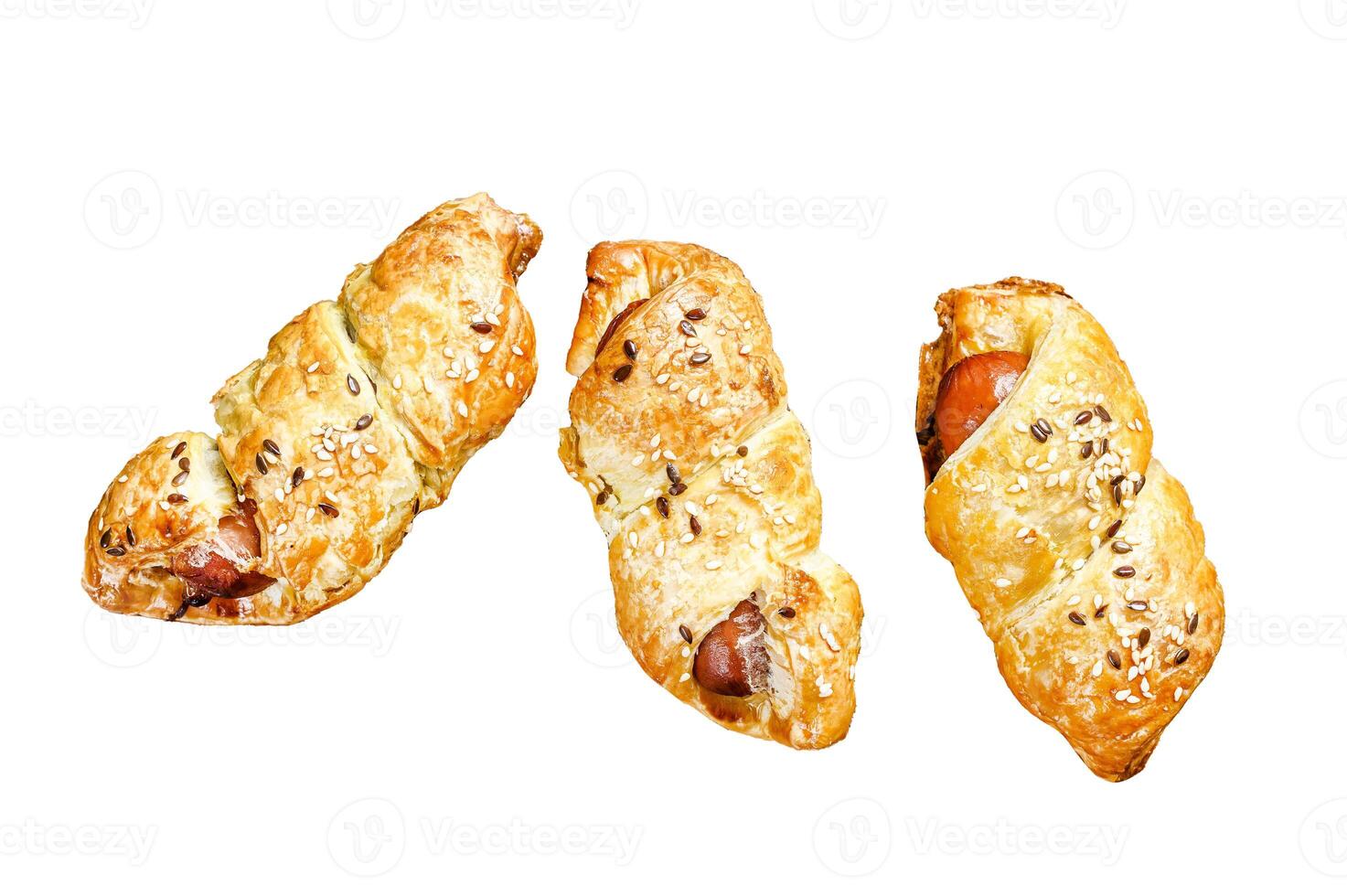 Cutting board with sausage rolls in the dough. Isolated on white background. Top view. photo