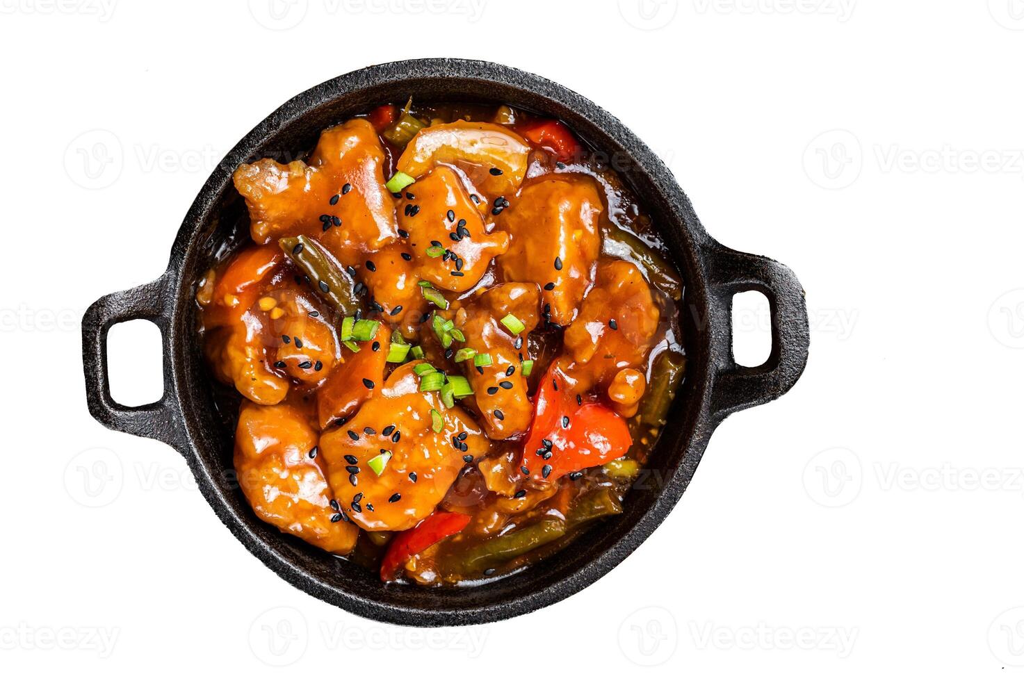 Chinese Sweet and sour chicken with colorful bell pepper in a skillet. Isolated on white background. photo