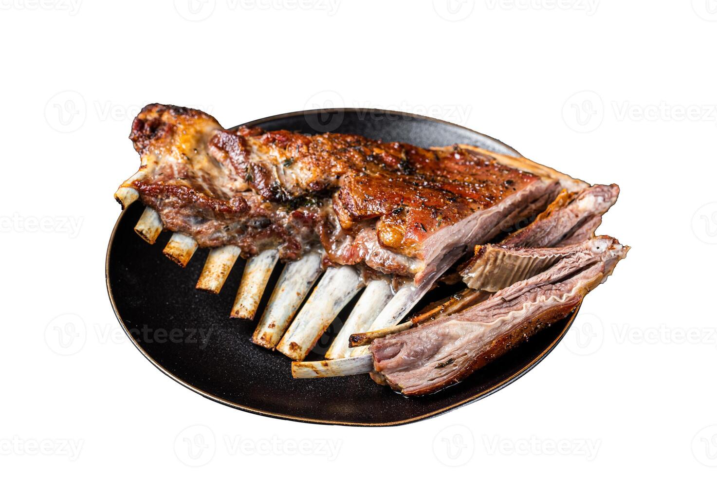 Roasted Rack of lamb ribs, mutton spareribs, sliced meat on plate. Isolated on white background. photo