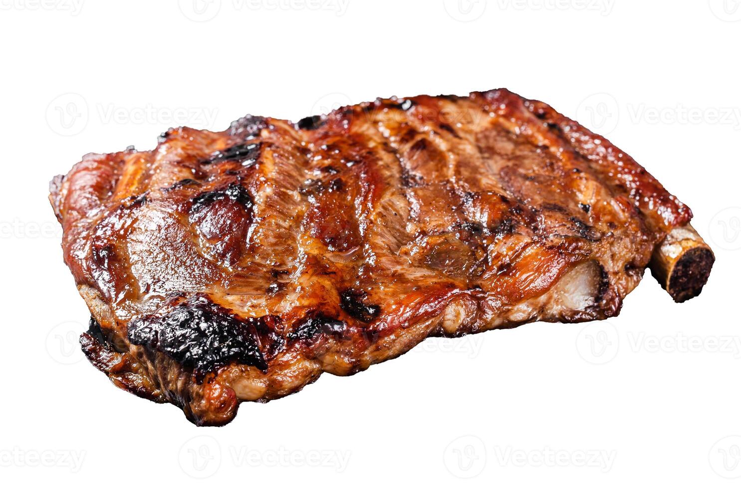 Full rack of BBQ grilled pork spare ribs on a marble board. Isolated, white background. photo