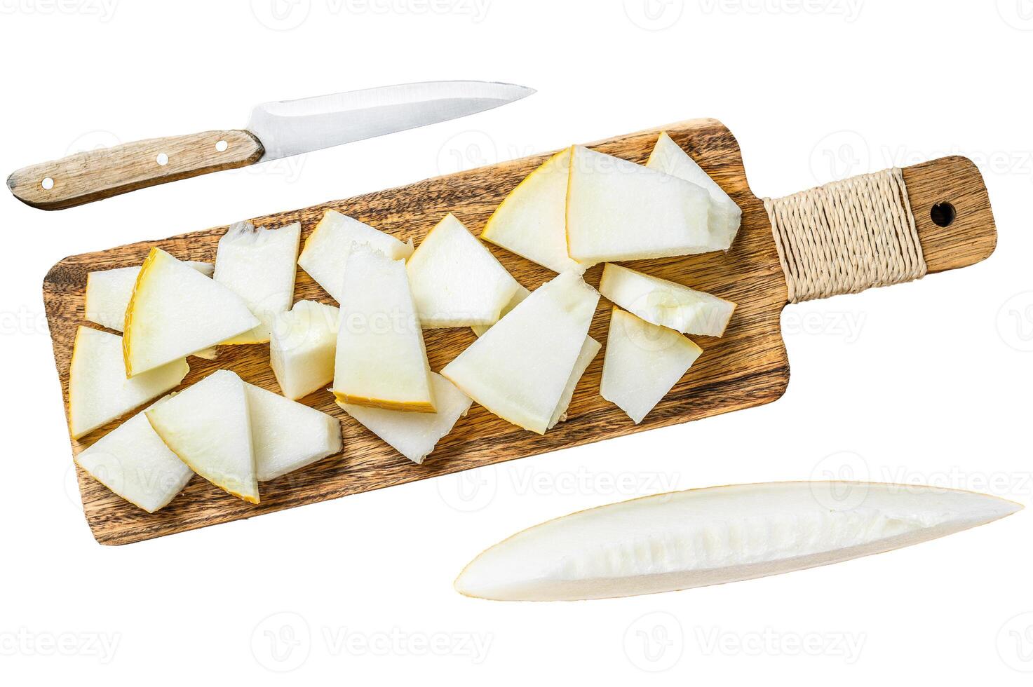 Slices of yellow melon on the cutting Board. Isolated on white background. Top view. photo