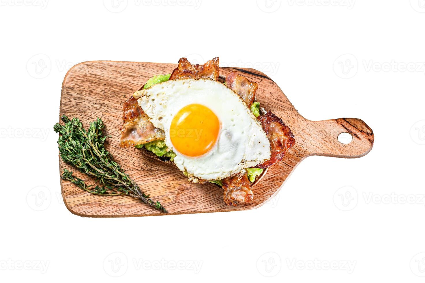 Toast with avocado, fried bacon and egg. Isolated on white background. Top view. photo
