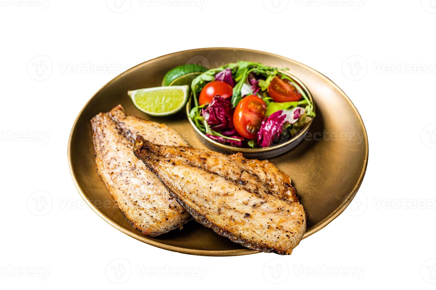 Roasted Gilthead Sea Bream fillets served with fresh vegetable salad. Isolated on white background. Top view. photo